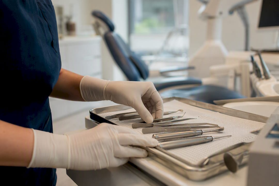 Dentist arranging surgical extraction tools