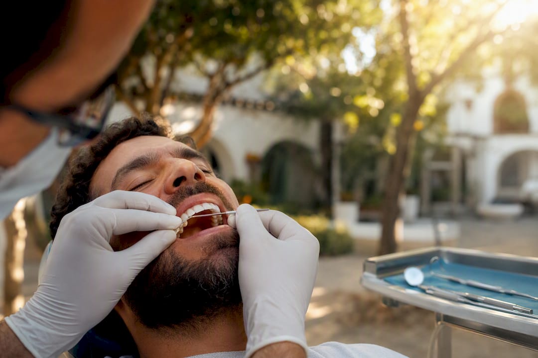 Dentist applying flexible splint to loose tooth