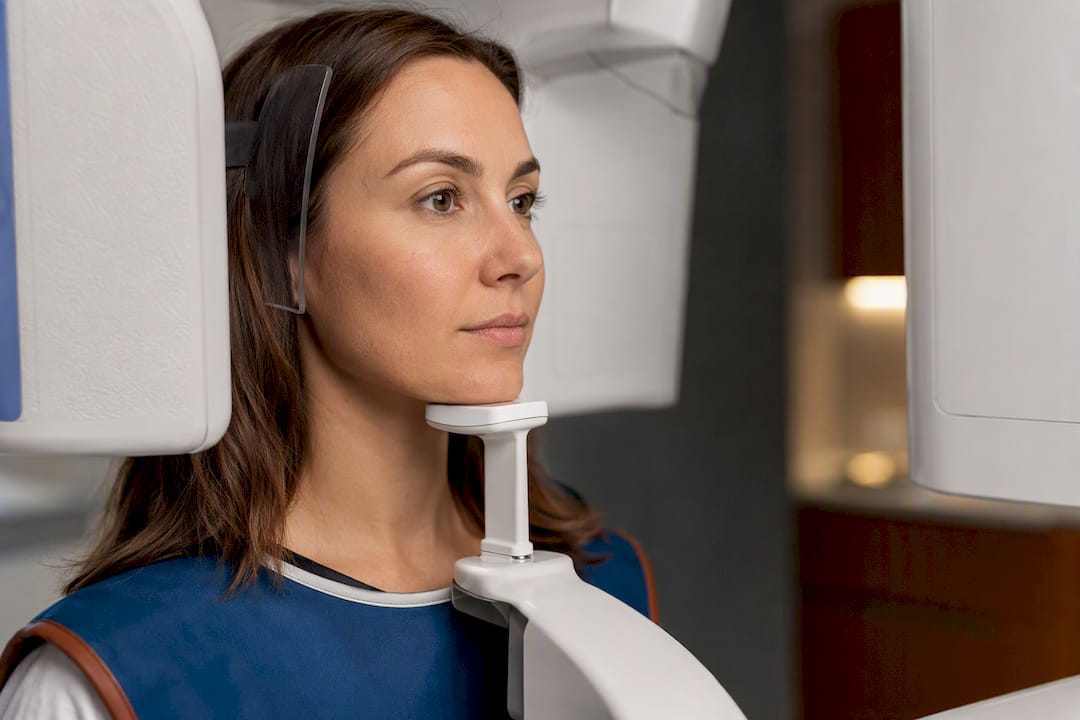 Patient holding still during dental CBCT scan