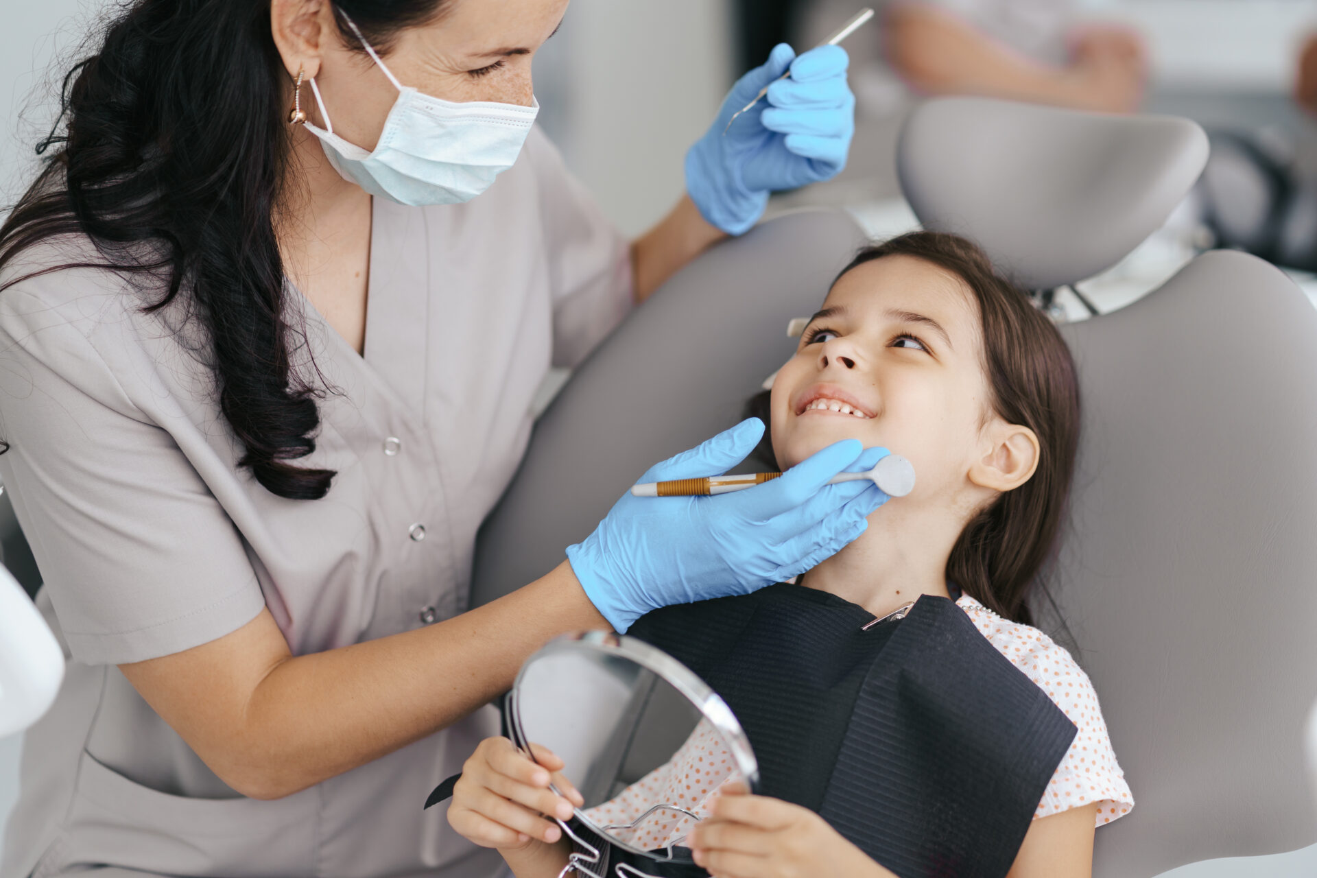 Little beautiful girl at the dentist smiling Pediatric Dentistry